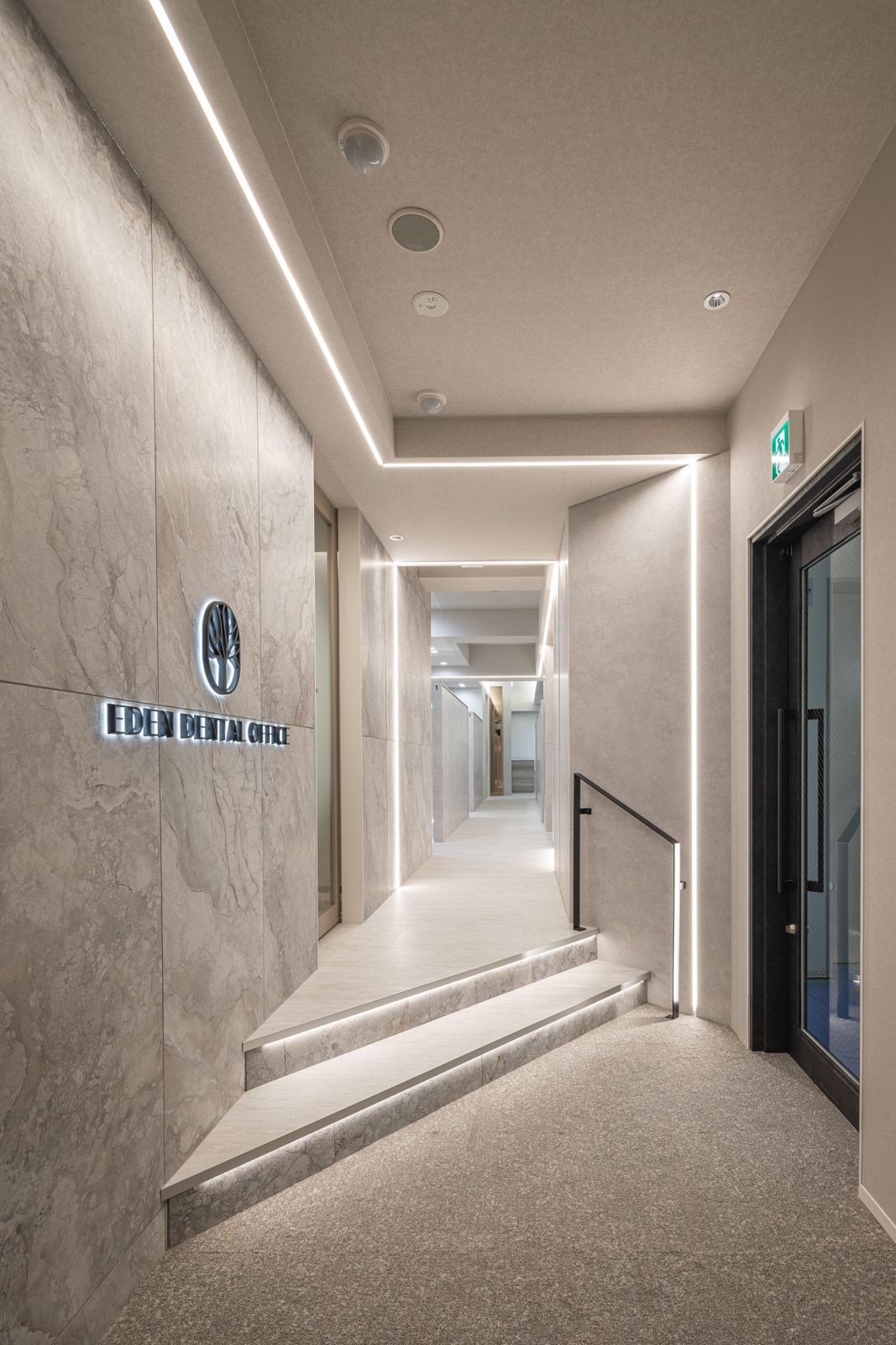 Eden Dental Office entrance — illuminated marble signage and corridor into the clinic in Nagoya